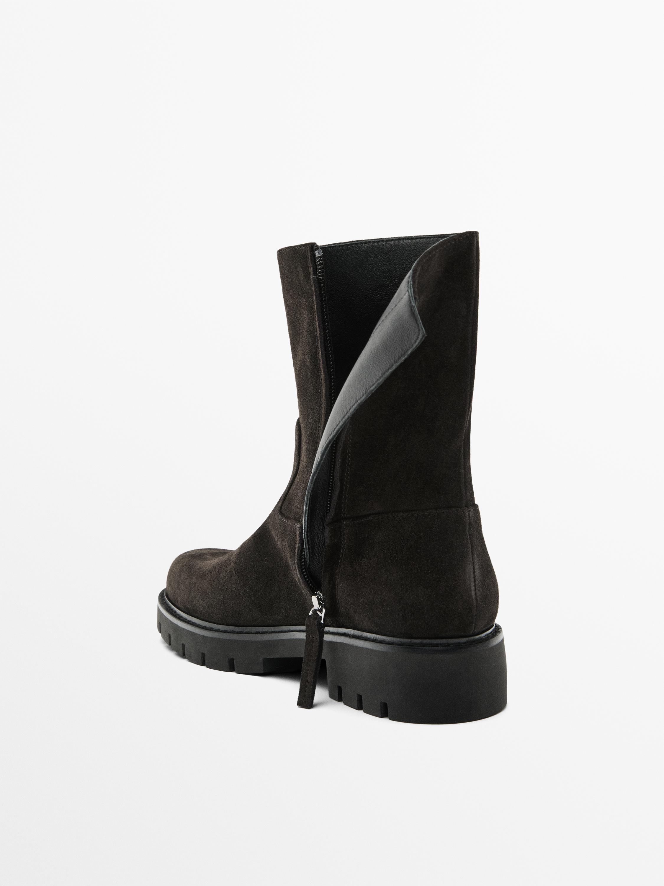 Bottines en croûte de cuir avec semelle crantée